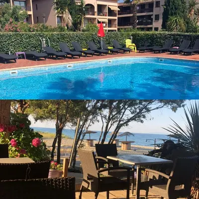 a swimming pool with chairs and a table and the ocean at Joli T2 les pieds dans l’eau , piscine tennis.... in San-Nicolao