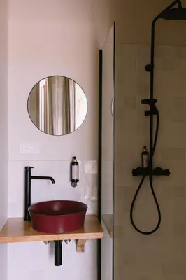 a bathroom with a red sink and a shower at L'Orangeraie d'Afa in Afa