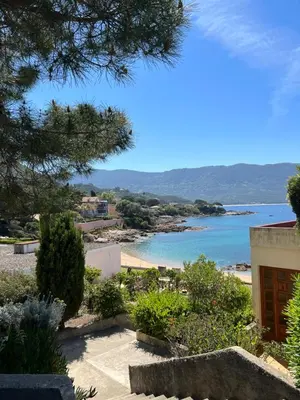 a view of the beach from a house at PIEDS DANS L'EAU, TIUCCIA, appartement 2-4 pers in Casaglione