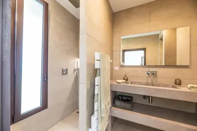 a bathroom with a sink and a mirror at Mogador in Bonifacio