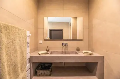 a bathroom with a sink and a mirror at Mogador in Bonifacio