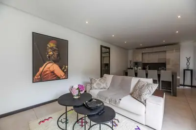 a living room with a couch and a table at Mogador in Bonifacio
