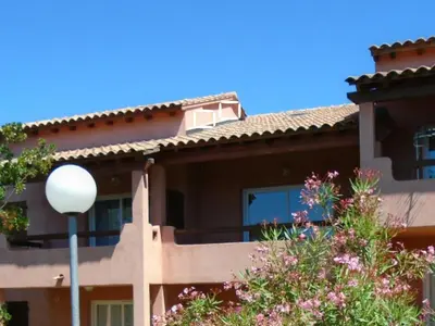 a building with a street light in front of it at VARDIOLA/PORTO VECCHIO in Pinarellu
