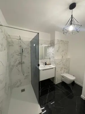 a bathroom with a shower and a sink and a toilet at Charmant T2 proche de la plage et au calme in Ajaccio