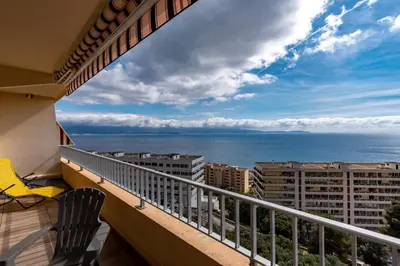 a balcony with a view of the ocean at Ajaccio, Sanguinaires, Hélios, vue mer magnifique, T2 4pers in Ajaccio