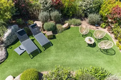 an aerial view of a lawn with chairs and tables at Villa Tinoeva Mare di Conca in Conca
