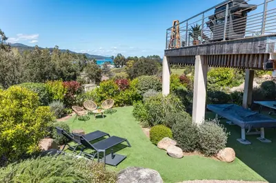 an aerial view of a garden with a deck at Villa Tinoeva Mare di Conca in Conca