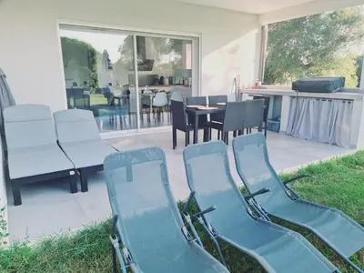 a group of chairs sitting on a patio at Location 