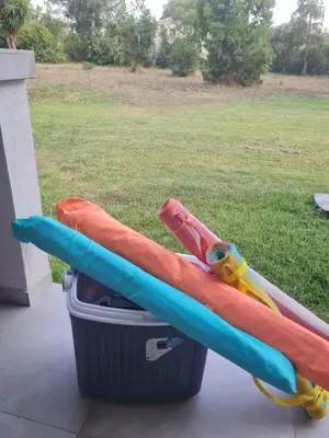 two inflatable tubes are sitting in a trash can at Location 