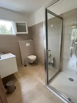 a bathroom with a shower and a toilet at Appartement Soveria in Soveria