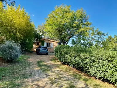 a car parked in front of a house at Domaine Punta della Guardia villa panorama maquis et mer, plage à 1,5 Km in Cervione