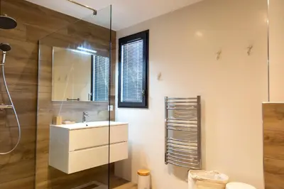 a bathroom with a sink and a glass shower at Domaine d'Arca - Hugo 09 - 6 pers - « Les Charmes » in Porto-Vecchio