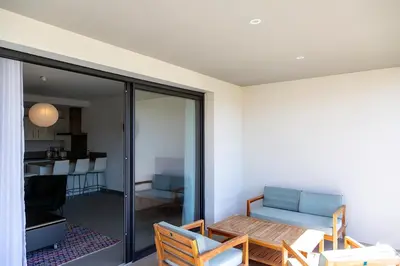 a living room with a couch and a table at Résidence Domaine d'Arca Porto Vecchio - T2 haut standing - 4 personnes 