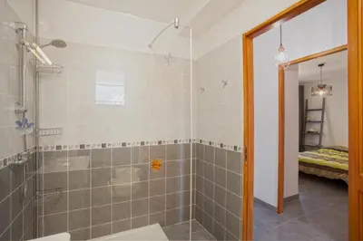 a bathroom with a shower and a walk in shower at Casa Chjara Maria in Vescovato