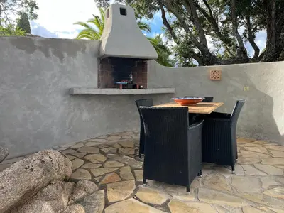 a kitchen with white appliances and a white refrigerator at Résidence Storia di Blue in Porto-Vecchio