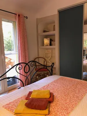a bedroom with a bed with two towels on it at Casa Mathilde in Lecci