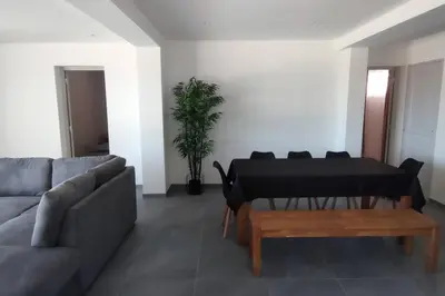 a living room with a couch and a piano at F4 à Porticcio avec piscine et vue sur mer in Porticcio