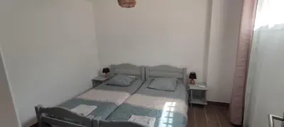 a bedroom with a bed and two pillows on it at F4 à Porticcio avec piscine et vue sur mer in Porticcio