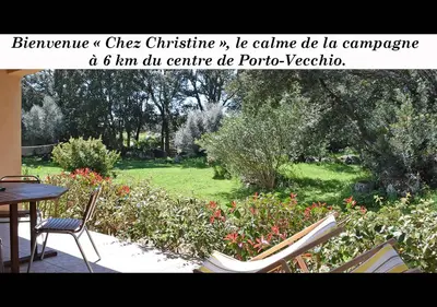 a picture of a garden with a table and chairs at Locations 
