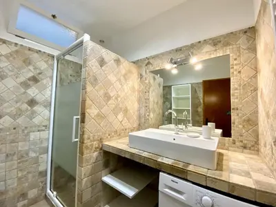 a bathroom with a sink and a shower at Les Roches de Figa in Conca