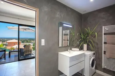 a bathroom with a sink and a washing machine at Casa Dolce Vita in Borgo