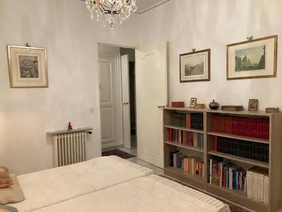 a bedroom with a book shelf with books at AJACCIO VUE MER, 3 chambres, 6 personnes in Ajaccio