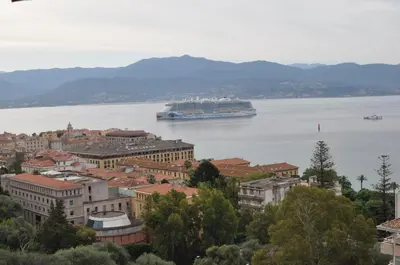 a cruise ship on the water in a city at AJACCIO VUE MER, 3 chambres, 6 personnes in Ajaccio
