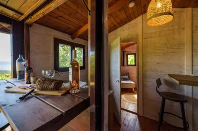 a dining room with a table in a house at Camping U Pirellu in Porto-Vecchio