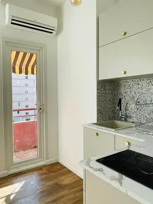 a kitchen with a sink and a window at Appartement Bonaparte centre ville d'Ajaccio in Ajaccio