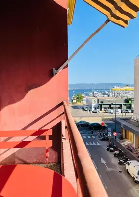 a view from the balcony of a building with a parking lot at Appartement Bonaparte centre ville d'Ajaccio in Ajaccio