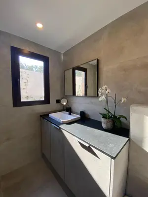 a bathroom with a sink and a mirror at La Verda in Bonifacio