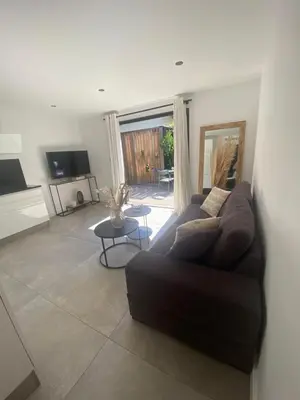 a living room with a couch and a table at La Verda in Bonifacio