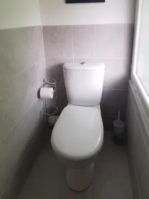 a bathroom with a white toilet in a room at Indè Noi - Maison de village proche commodités in Murato