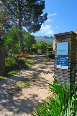 a sign for the cayason garden in a park at CASA di u cuginu in Calenzana