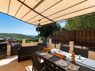 a patio with a table with food on it at Holiday Home Pietralunga 8 by Interhome in Sotta
