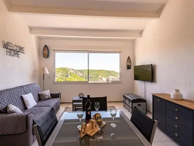 a living room with a couch and a table at Holiday Home Pietralunga 8 by Interhome in Sotta