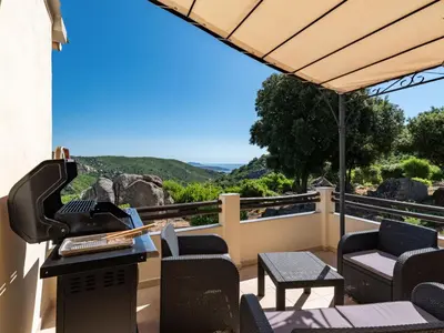 a balcony with a piano and chairs and a view at Holiday Home Pietralunga 8 by Interhome in Sotta