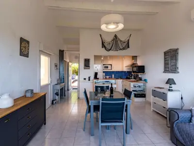 a kitchen and dining room with a table and chairs at Holiday Home Pietralunga 8 by Interhome in Sotta