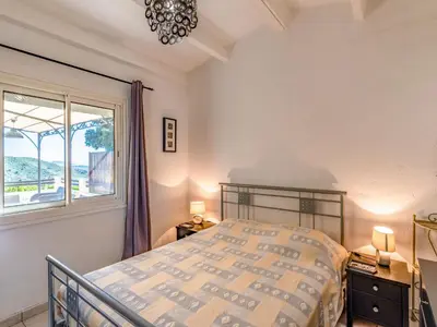 a bedroom with a bed and a window at Holiday Home Pietralunga 8 by Interhome in Sotta