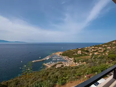 a view of a small island in the water at Apartment La Spelunca by Interhome in Cargèse