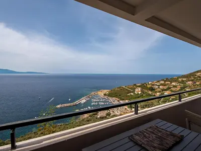 a balcony with a view of the ocean at Apartment La Spelunca by Interhome in Cargèse