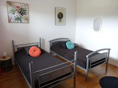 two twin beds in a room with at Apartment Résidence Cita Di Sali 12 by Interhome in Porto-Vecchio