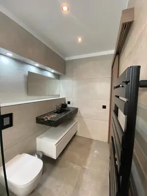 a bathroom with a toilet and a sink at Mini-Villa Jade in Bonifacio