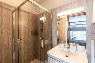 a bathroom with a shower and a sink at Le Balcon dAjaccio in Ajaccio
