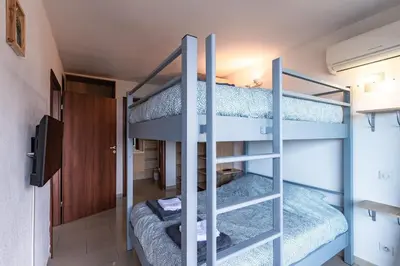 a bunk bed room with two bunk beds at Le Balcon dAjaccio in Ajaccio