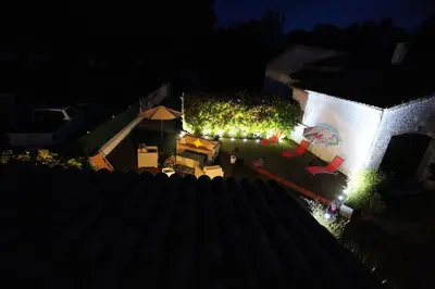 an overhead view of a yard with lights on a building at Campo Vecchio Dracena et Piscine in Ghisonaccia