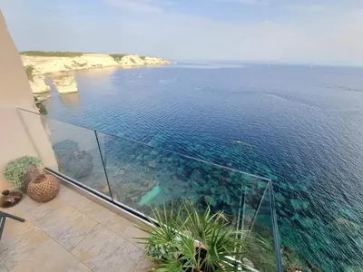 a view of the ocean from a house balcony at Mare è rocca in Bonifacio