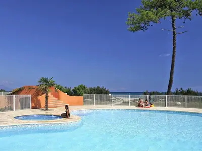 a house with a fence in front of it at Apartment in Corsica with Beach Access in Borgo
