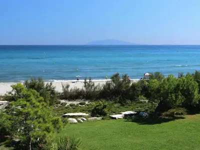 a beach with the ocean in the background at Apartment in Corsica with Beach Access in Borgo