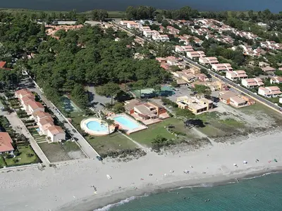 an aerial view of a resort with a beach at Apartment in Corsica with Beach Access in Borgo